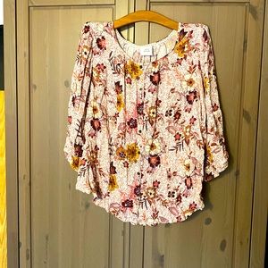 Button up blouse with puffy sleeves embellished with lace cut out on sleeves